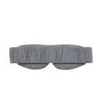 The back of a grey sleep mask on a white background