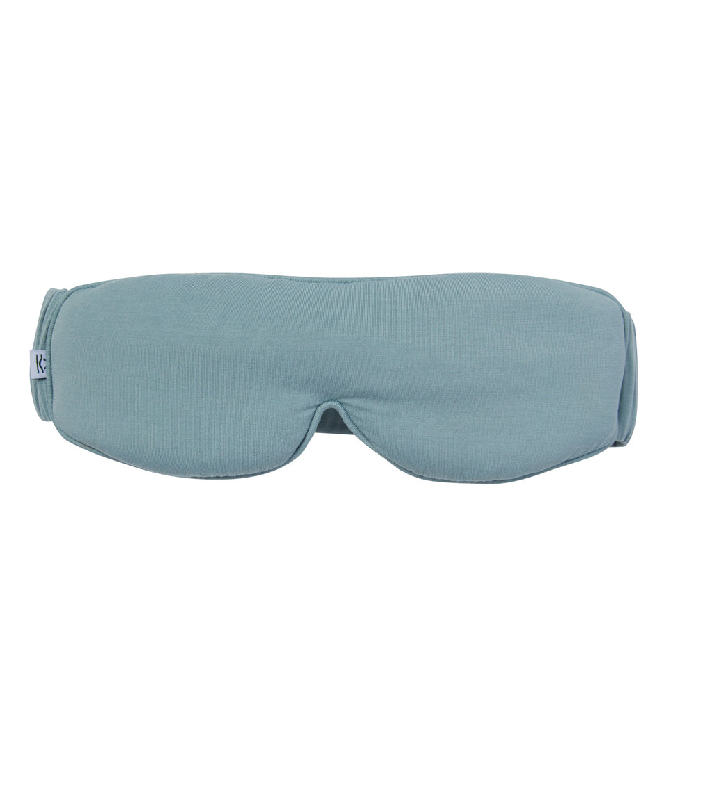 A light blue-grey fabric sleep mask shown flat against a solid white background.