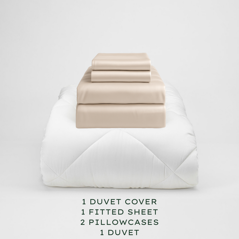 
                  
                    Oatmeal bedding set with duvet, duvet cover, fitted sheet, and pillowcases on a light gray background.
                  
                
