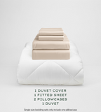 Oatmeal bedding set with duvet, duvet cover, fitted sheet, and pillowcases on a light gray background.