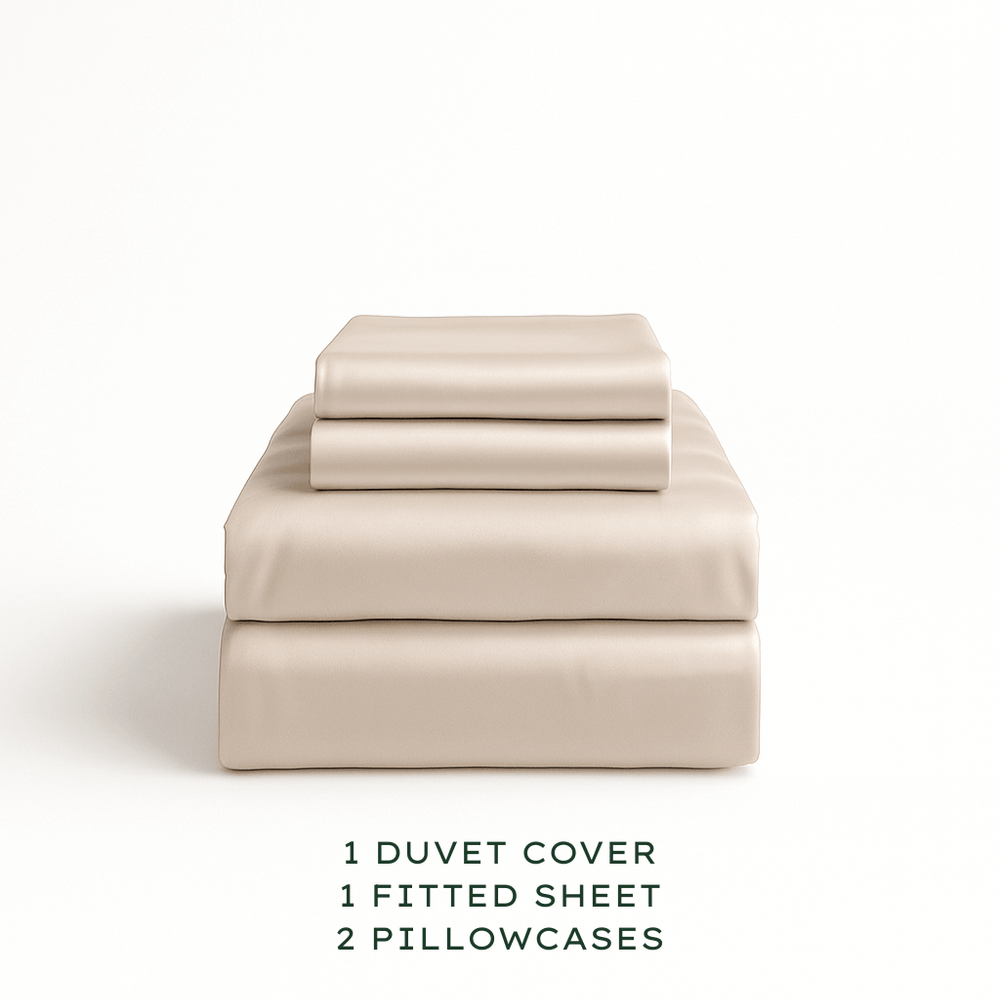 
                  
                    Oatmeal bedding set with duvet cover, fitted sheet, and pillowcases on a white background.
                  
                