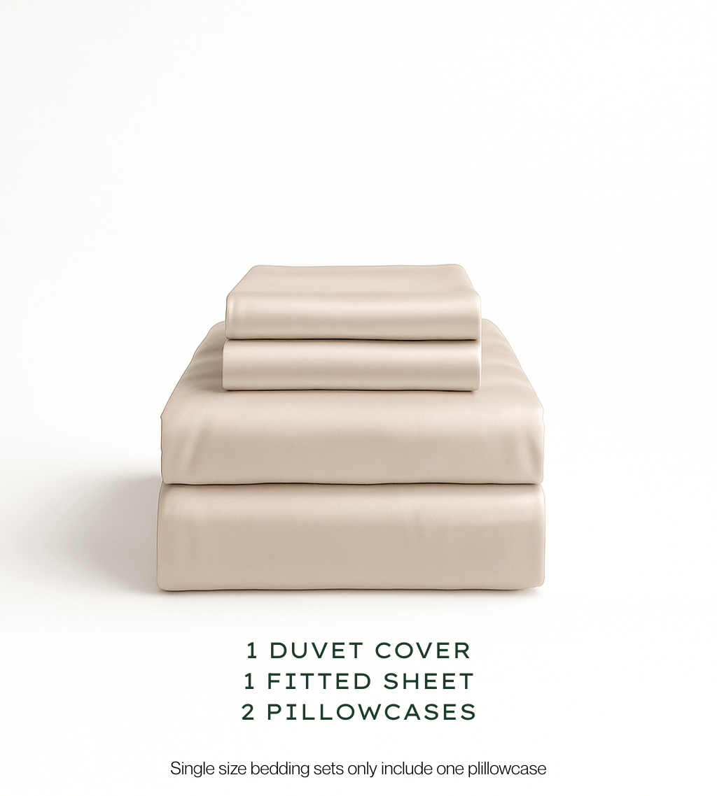 Oatmeal bedding set with duvet cover, fitted sheet, and pillowcases on a white background.