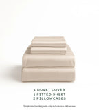 Oatmeal bedding set with duvet cover, fitted sheet, and pillowcases on a white background.