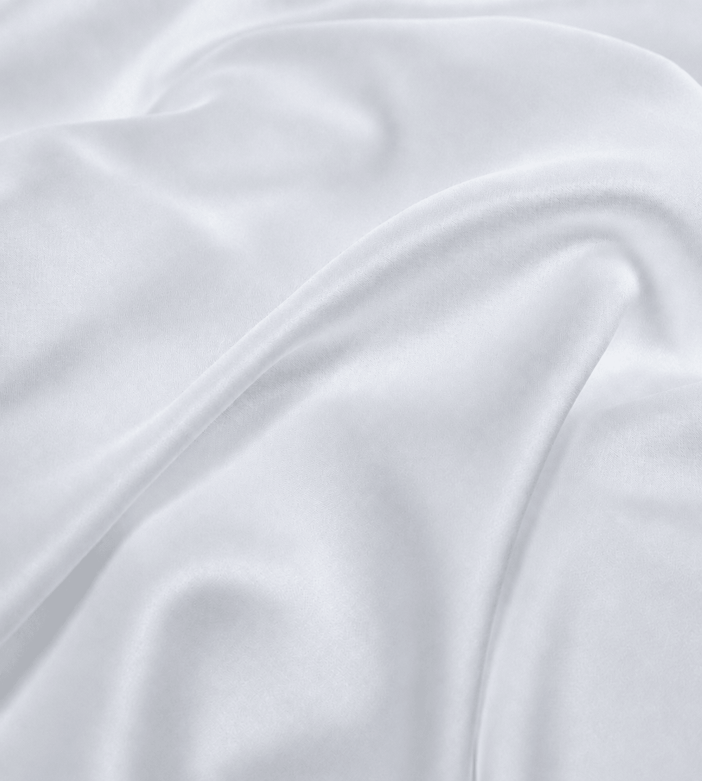 Close-up of soft grey fabric with folds