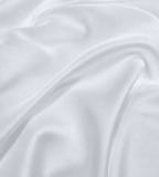 Close-up of soft grey fabric with folds
