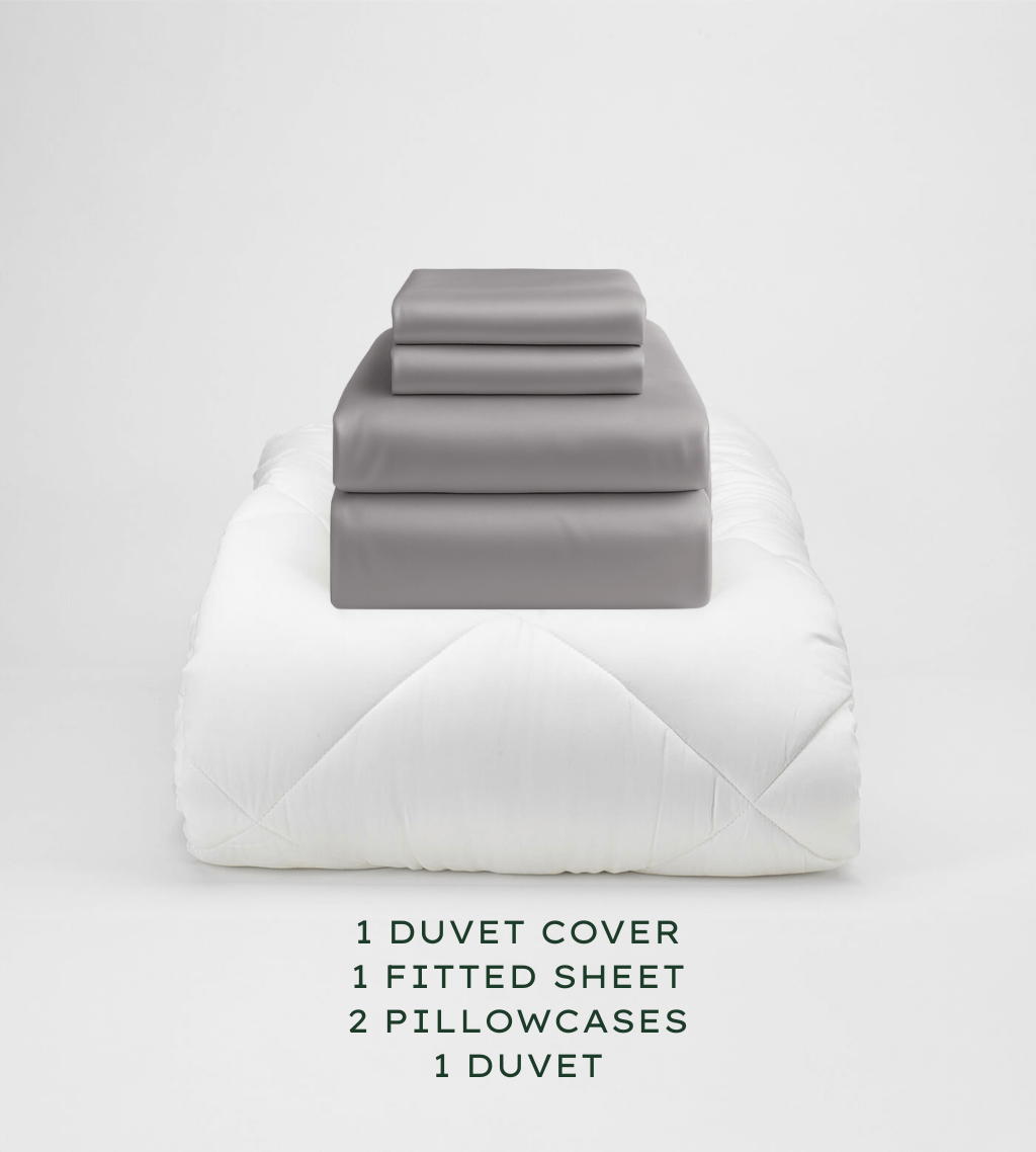 Gray bedding set with duvet cover, fitted sheet, and pillowcases on a white background