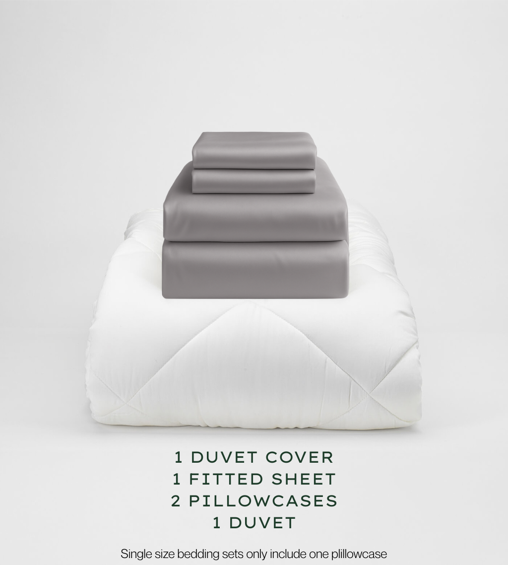 Warm Grey bedding set with duvet, duvet cover, fitted sheet, and pillowcases on a light gray background.