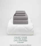 Warm Grey bedding set with duvet, duvet cover, fitted sheet, and pillowcases on a light gray background.