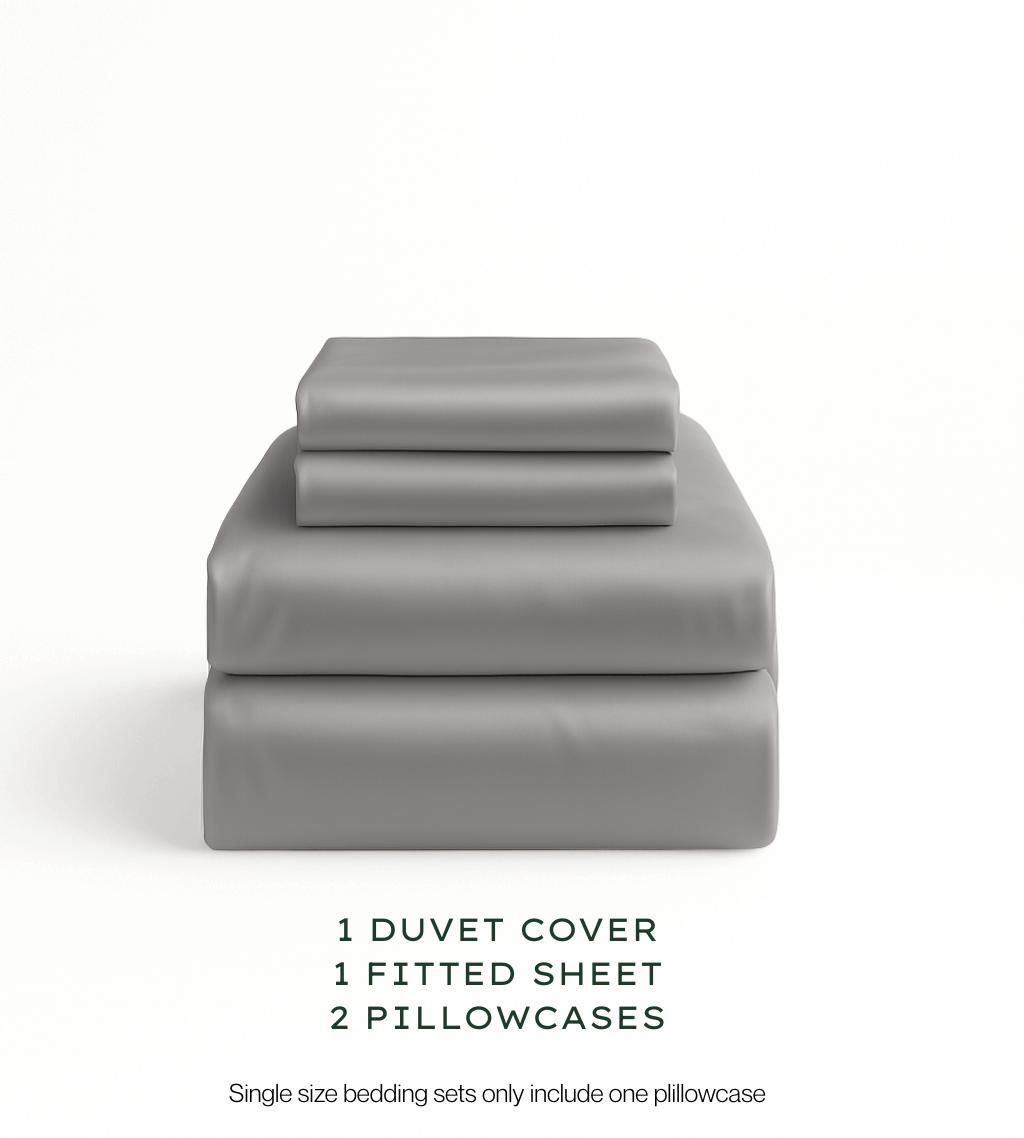 Warm Grey bedding set with duvet cover, fitted sheet, and pillowcases on a white background.