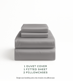 Warm Grey bedding set with duvet cover, fitted sheet, and pillowcases on a white background.
