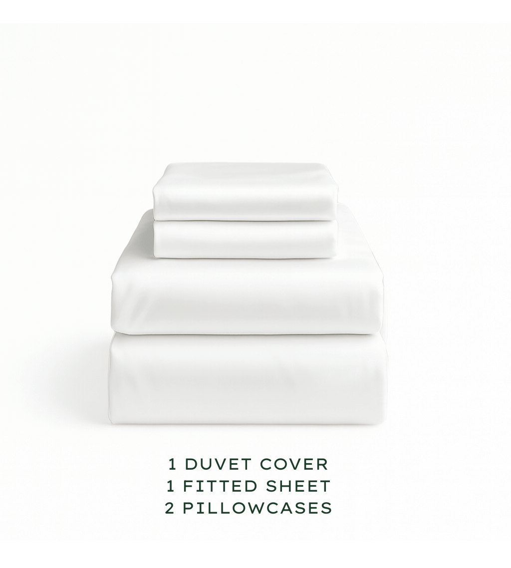 Set of white bedding including a duvet cover, fitted sheet, and pillowcases on a white background.