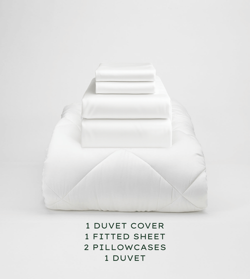 Set of white bedding including a duvet cover, fitted sheet, and pillowcases on a light gray background.