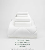 White bedding set with duvet, duvet cover, fitted sheet, and pillowcases on a light gray background.